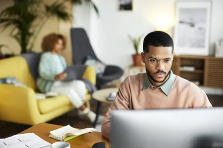 man using computer to look at website pop up examples